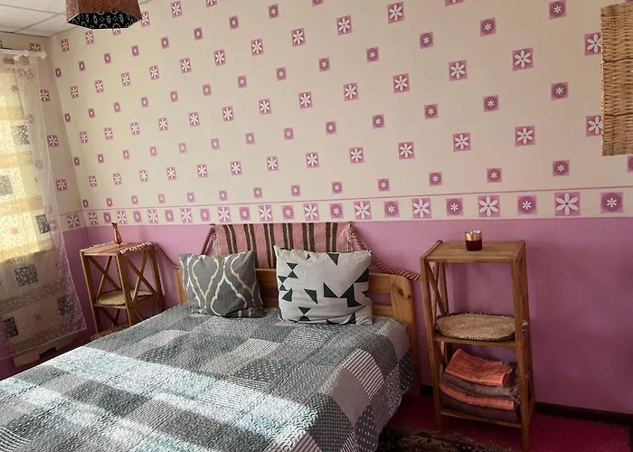 Quarto em Acomodações Particulares Cosy Puessi Town