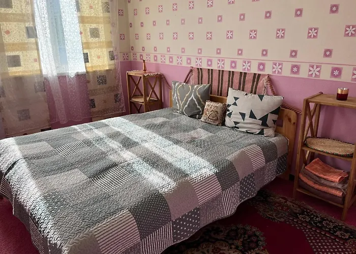 Quarto em Acomodações Particulares Cosy Puessi Town